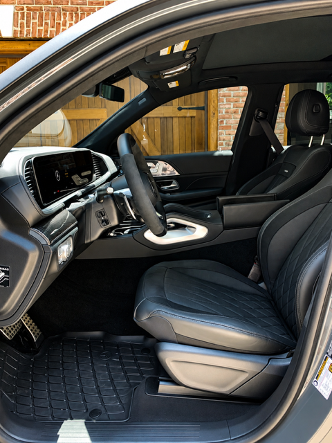 Mercedes GLE cabin with cleaned black leather seats, mats, and console