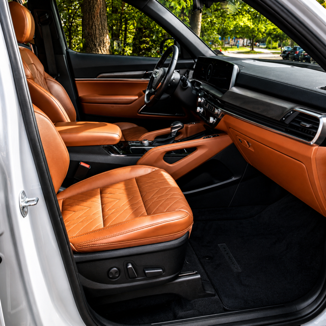 SUV interior with cognac leather seats and dashboard cleaned and conditioned